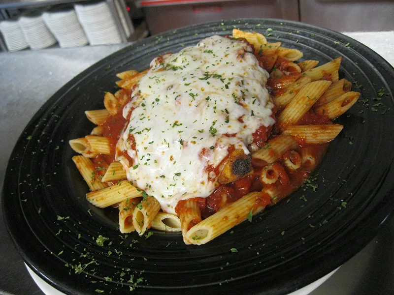 Chicken parm over penne with melted mozzarella