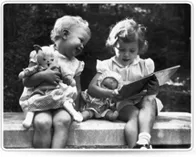 Vintage photo of two small children on a stoop